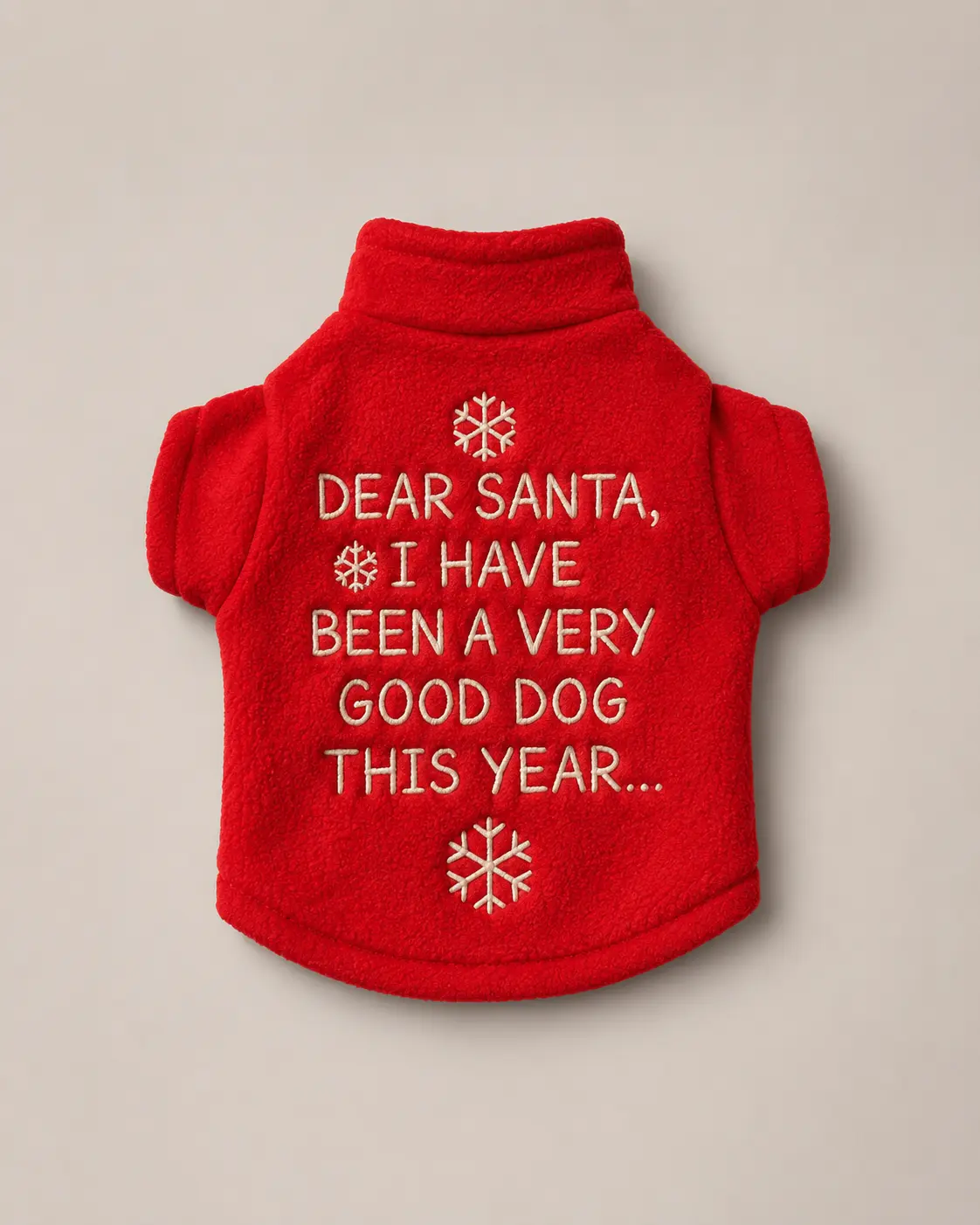 Red fleece dog pullover embroidered with Dear Santa lettering and snowflakes