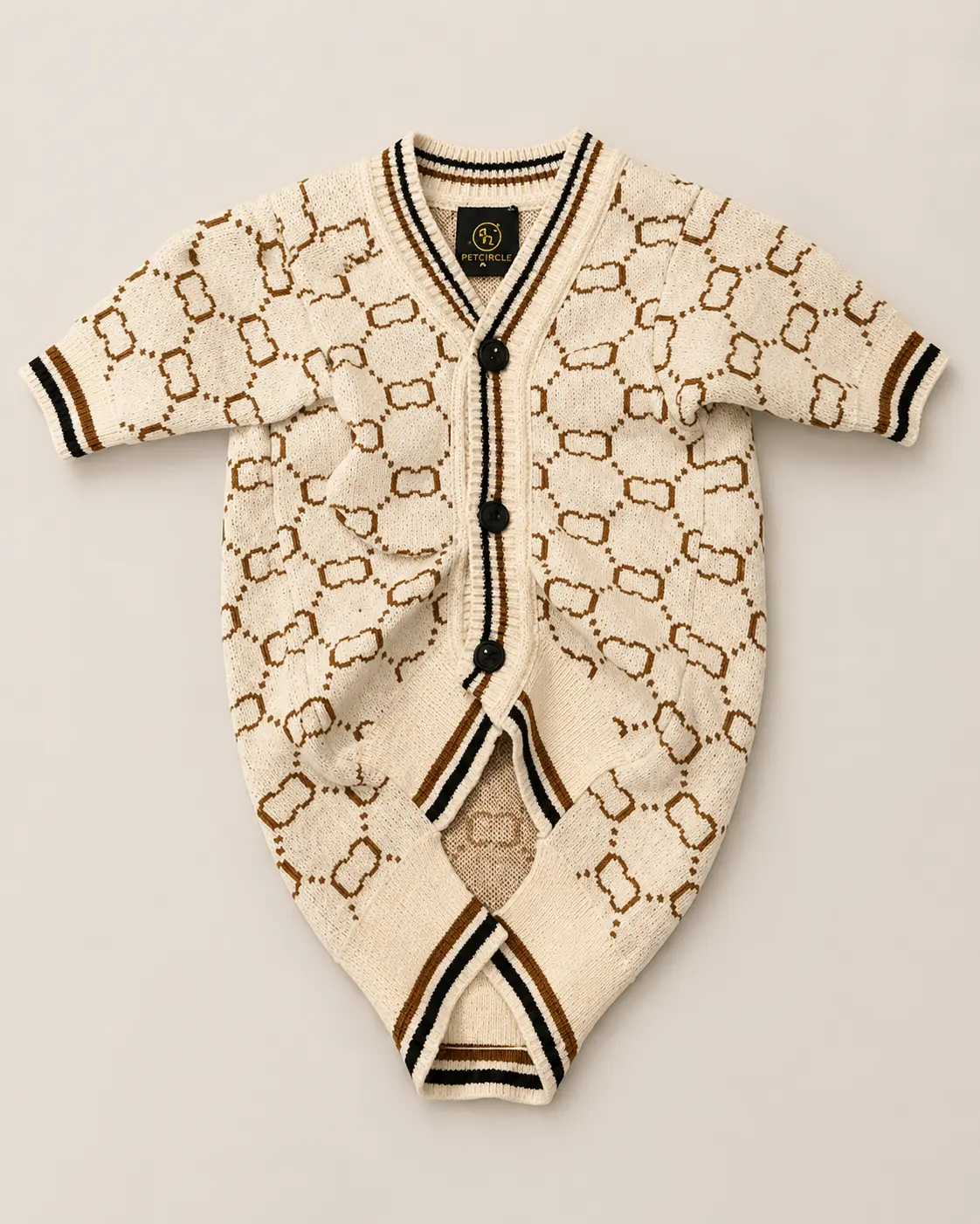 Ivory monogram knit dog jumpsuit with black buttons and striped trim