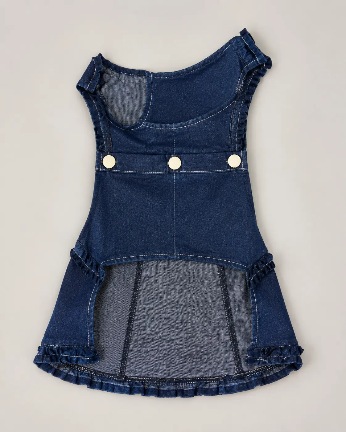Dark indigo denim dog dress with ruffled trim and gold snap buttons