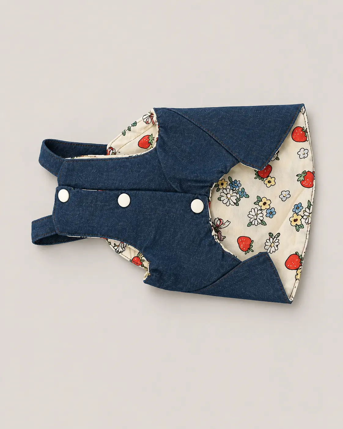 Denim dog jacket with white snaps and strawberry floral printed lining